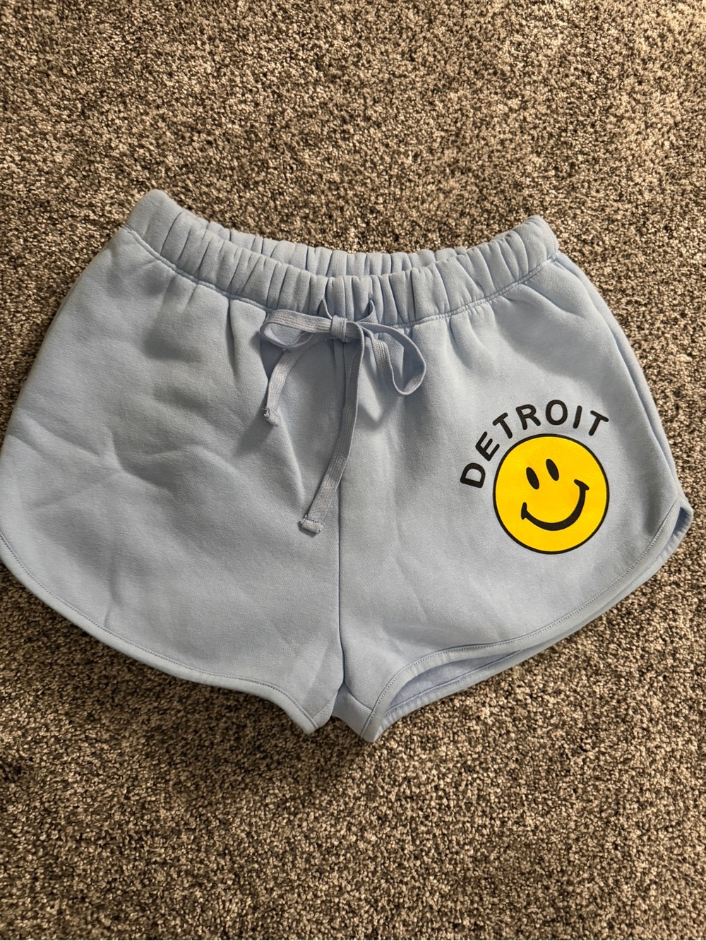 Blue sweat shorts with yellow smiley face graphic and 'DETROIT' text, size S